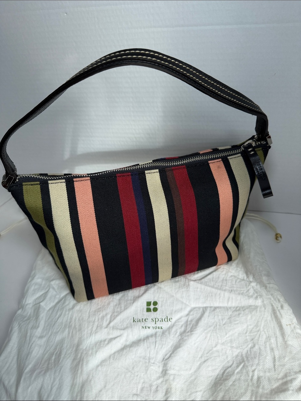 kate spade Multicolor Striped Wristlet with Pink Tassel